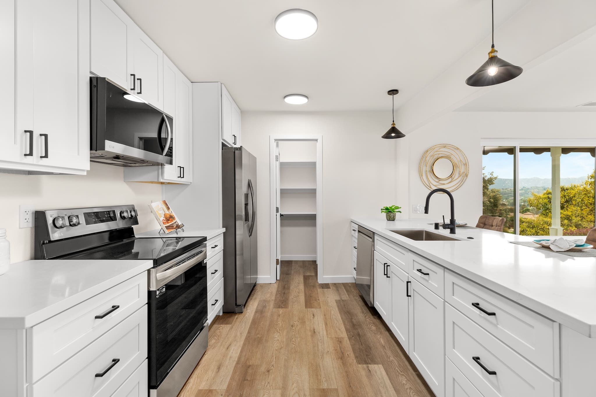 Modern ADU construction in San Diego with a stylish backyard.   Custom-built accessory dwelling unit (ADU) with energy-efficient design.   San Diego ADU builders working on a detached guest house.   Luxury home remodeling project in San Diego featuring a modern kitchen.   San Diego home renovation with upgraded interiors and open floor plan.   Bathroom remodel in San Diego with sleek tile and custom vanity.   New home construction project in San Diego with contemporary design.   Experienced San Diego construction team building a custom home.   High-quality residential construction site in San Diego.