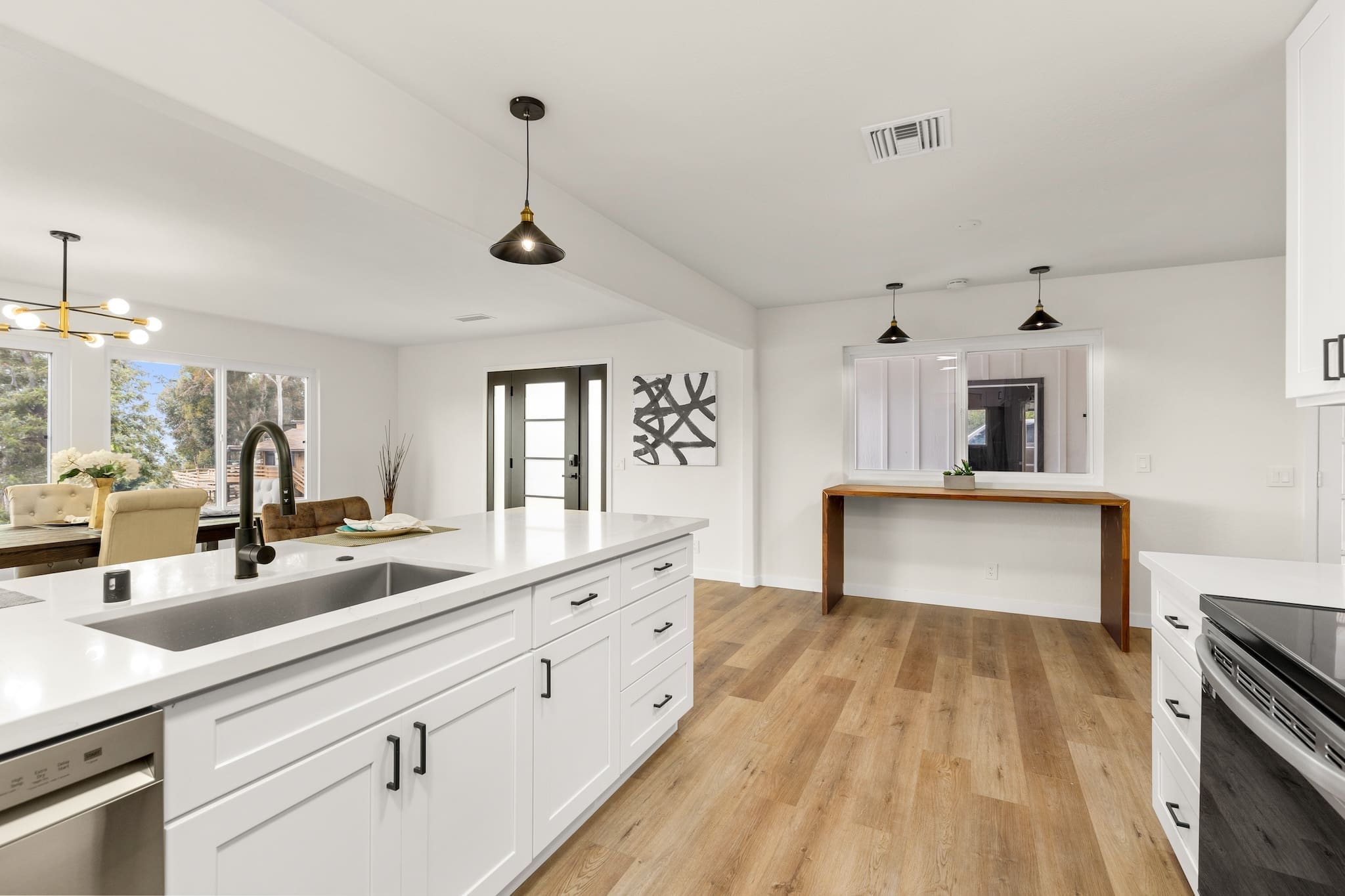 Modern ADU construction in San Diego with a stylish backyard.   Custom-built accessory dwelling unit (ADU) with energy-efficient design.   San Diego ADU builders working on a detached guest house.   Luxury home remodeling project in San Diego featuring a modern kitchen.   San Diego home renovation with upgraded interiors and open floor plan.   Bathroom remodel in San Diego with sleek tile and custom vanity.   New home construction project in San Diego with contemporary design.   Experienced San Diego construction team building a custom home.   High-quality residential construction site in San Diego.