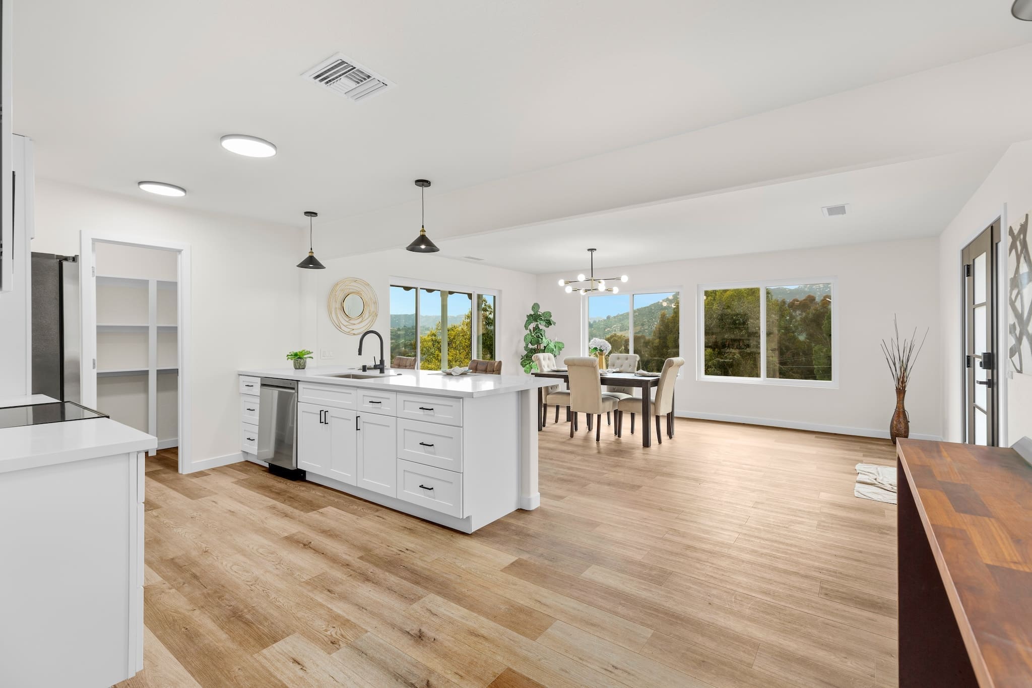 Modern ADU construction in San Diego with a stylish backyard.   Custom-built accessory dwelling unit (ADU) with energy-efficient design.   San Diego ADU builders working on a detached guest house.   Luxury home remodeling project in San Diego featuring a modern kitchen.   San Diego home renovation with upgraded interiors and open floor plan.   Bathroom remodel in San Diego with sleek tile and custom vanity.   New home construction project in San Diego with contemporary design.   Experienced San Diego construction team building a custom home.   High-quality residential construction site in San Diego.