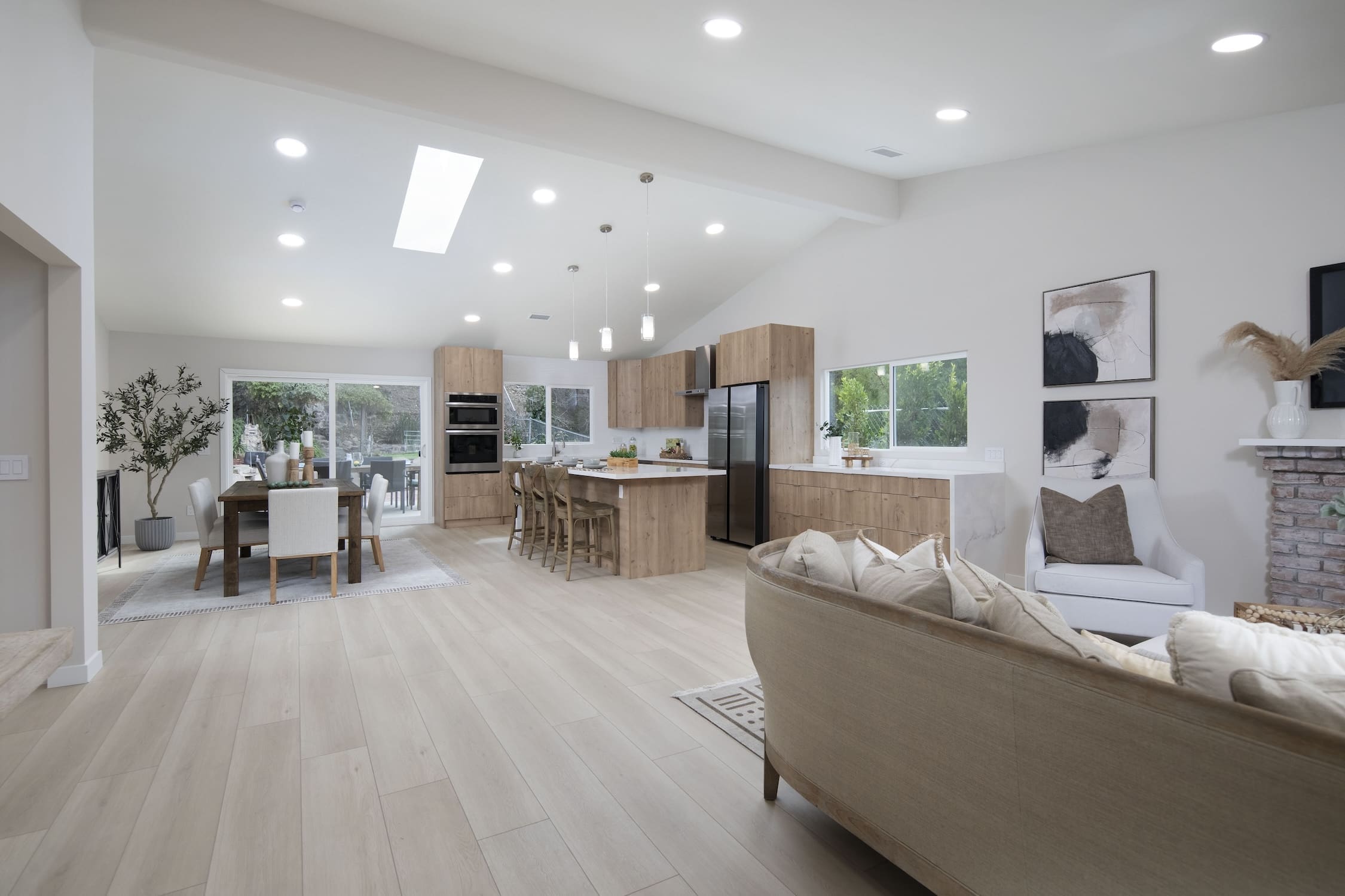 a living room with a kitchen and dining area