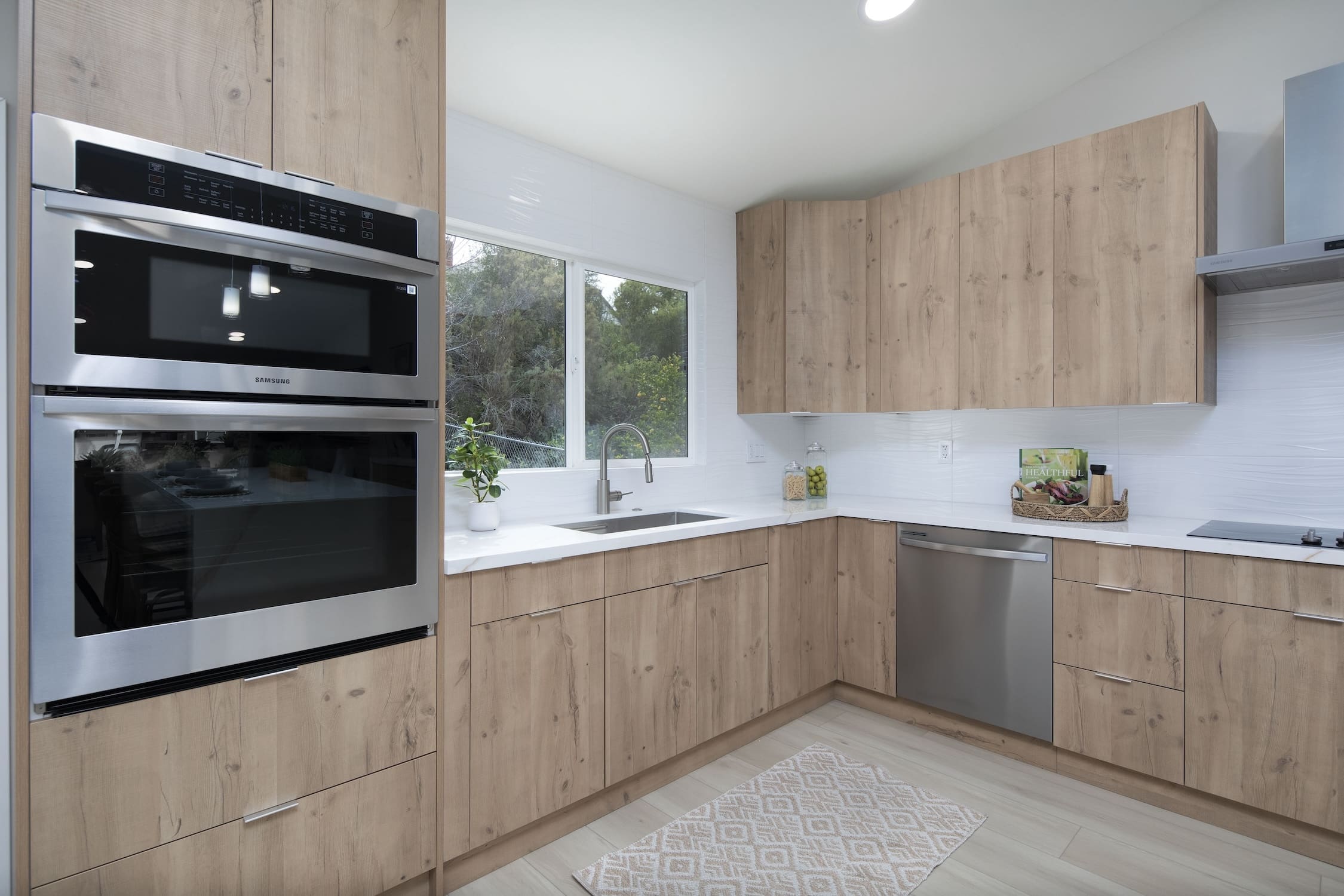 Modern ADU construction in San Diego with a stylish backyard.   Custom-built accessory dwelling unit (ADU) with energy-efficient design.   San Diego ADU builders working on a detached guest house.   Luxury home remodeling project in San Diego featuring a modern kitchen.   San Diego home renovation with upgraded interiors and open floor plan.   Bathroom remodel in San Diego with sleek tile and custom vanity.   New home construction project in San Diego with contemporary design.   Experienced San Diego construction team building a custom home.   High-quality residential construction site in San Diego.