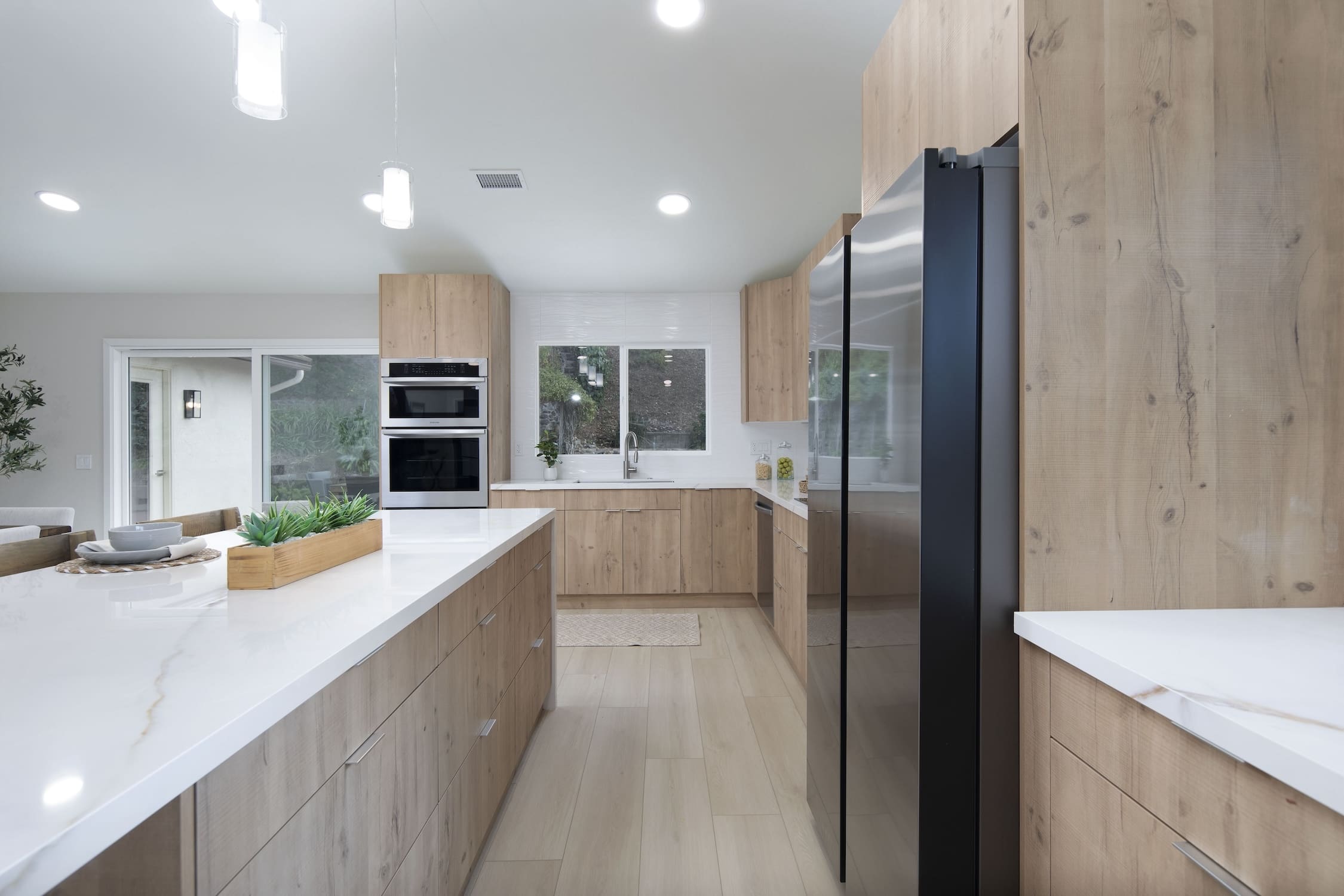 Modern ADU construction in San Diego with a stylish backyard.   Custom-built accessory dwelling unit (ADU) with energy-efficient design.   San Diego ADU builders working on a detached guest house.   Luxury home remodeling project in San Diego featuring a modern kitchen.   San Diego home renovation with upgraded interiors and open floor plan.   Bathroom remodel in San Diego with sleek tile and custom vanity.   New home construction project in San Diego with contemporary design.   Experienced San Diego construction team building a custom home.   High-quality residential construction site in San Diego.