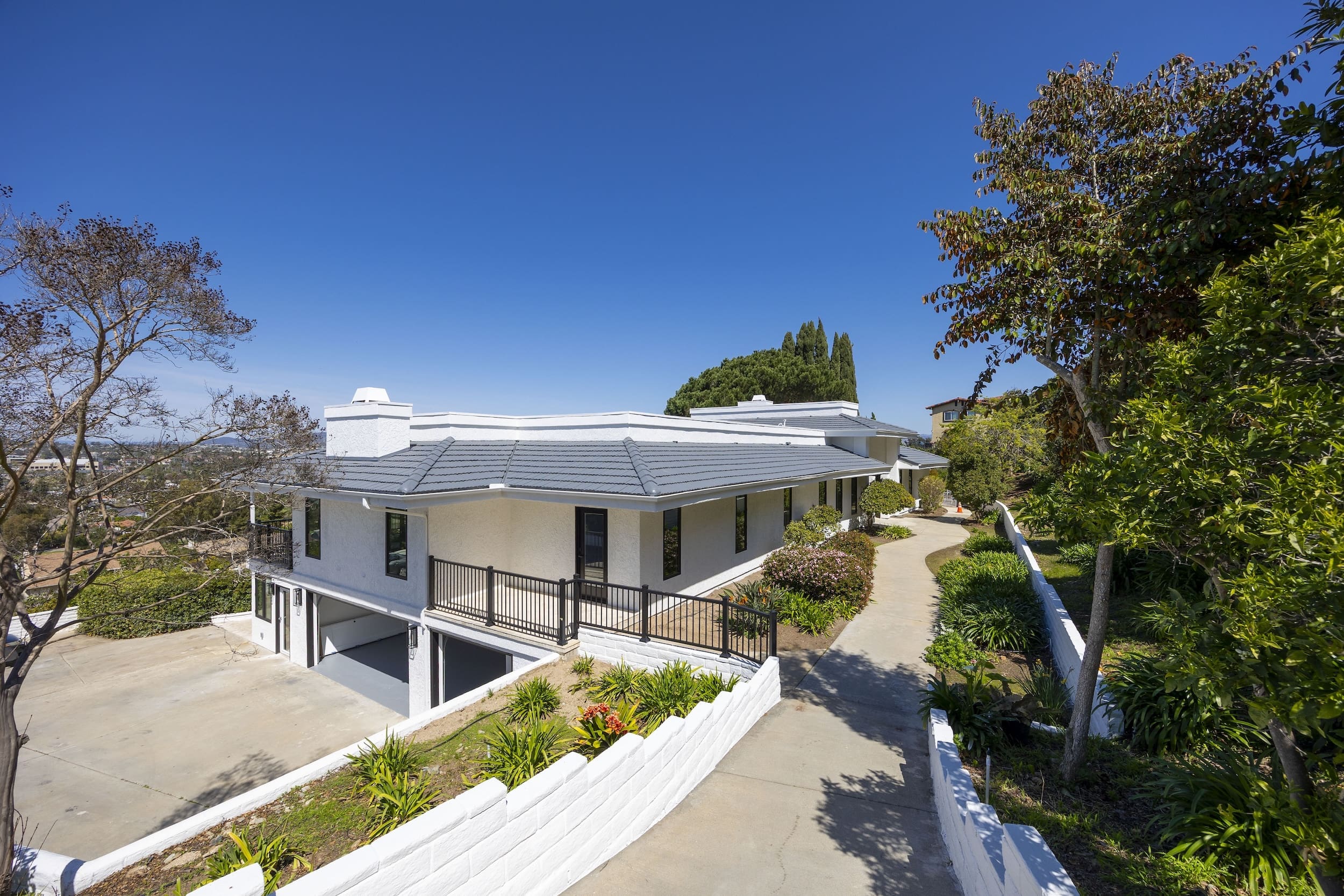 Modern ADU construction in San Diego with a stylish backyard.   Custom-built accessory dwelling unit (ADU) with energy-efficient design.   San Diego ADU builders working on a detached guest house.   Luxury home remodeling project in San Diego featuring a modern kitchen.   San Diego home renovation with upgraded interiors and open floor plan.   Bathroom remodel in San Diego with sleek tile and custom vanity.   New home construction project in San Diego with contemporary design.   Experienced San Diego construction team building a custom home.   High-quality residential construction site in San Diego.