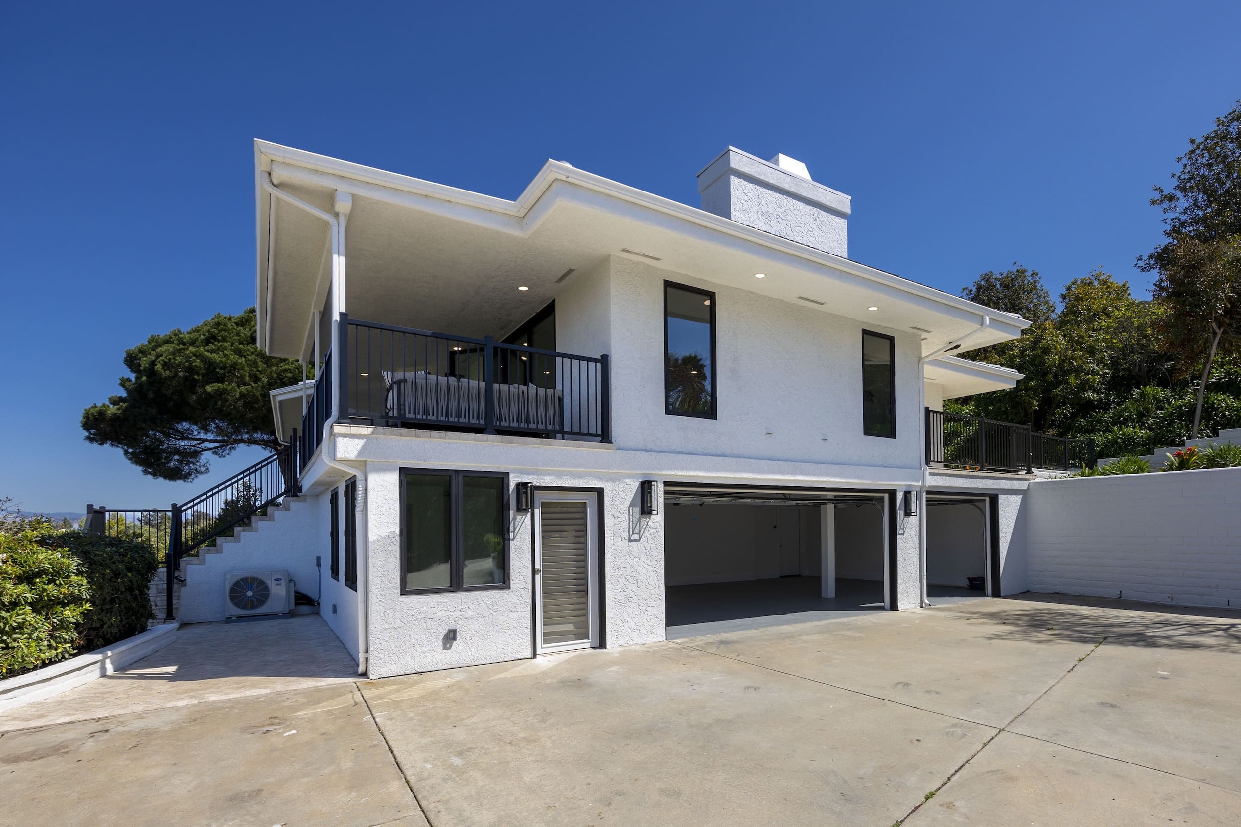 Modern ADU construction in San Diego with a stylish backyard.   Custom-built accessory dwelling unit (ADU) with energy-efficient design.   San Diego ADU builders working on a detached guest house.   Luxury home remodeling project in San Diego featuring a modern kitchen.   San Diego home renovation with upgraded interiors and open floor plan.   Bathroom remodel in San Diego with sleek tile and custom vanity.   New home construction project in San Diego with contemporary design.   Experienced San Diego construction team building a custom home.   High-quality residential construction site in San Diego.