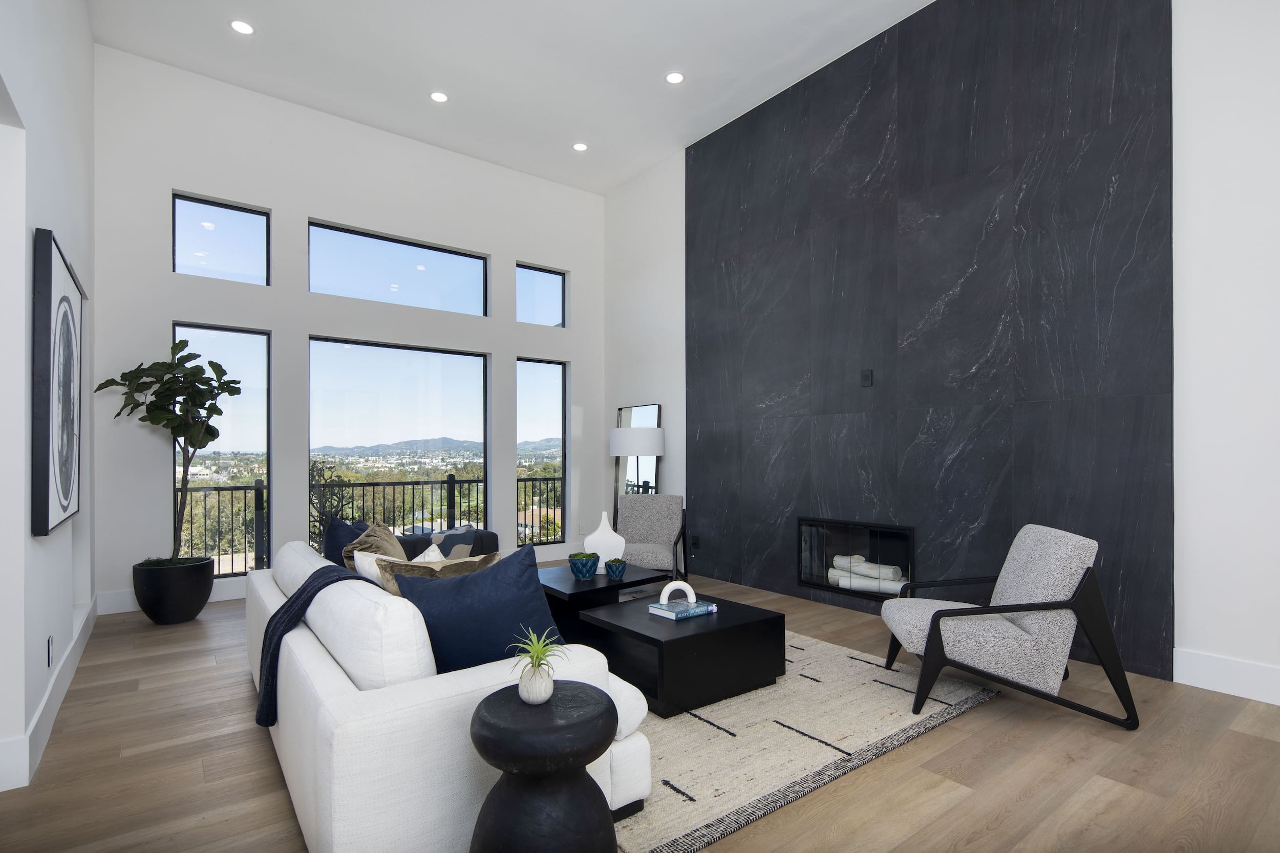 High-end complete home remodel living room with stone feature wall and fireplace — Rancho Santa Fe San Diego CA