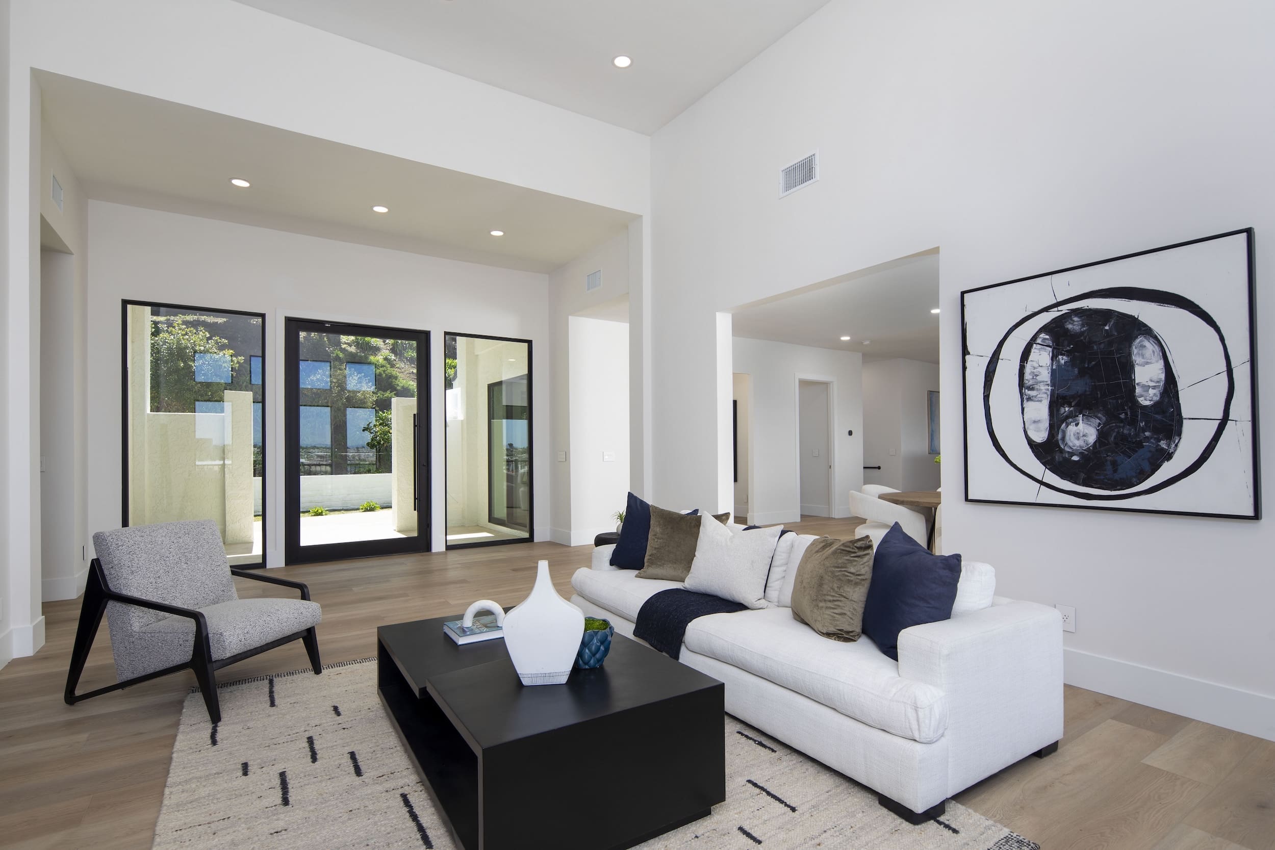 Modern ADU construction in San Diego with a stylish backyard.   Custom-built accessory dwelling unit (ADU) with energy-efficient design.   San Diego ADU builders working on a detached guest house.   Luxury home remodeling project in San Diego featuring a modern kitchen.   San Diego home renovation with upgraded interiors and open floor plan.   Bathroom remodel in San Diego with sleek tile and custom vanity.   New home construction project in San Diego with contemporary design.   Experienced San Diego construction team building a custom home.   High-quality residential construction site in San Diego.