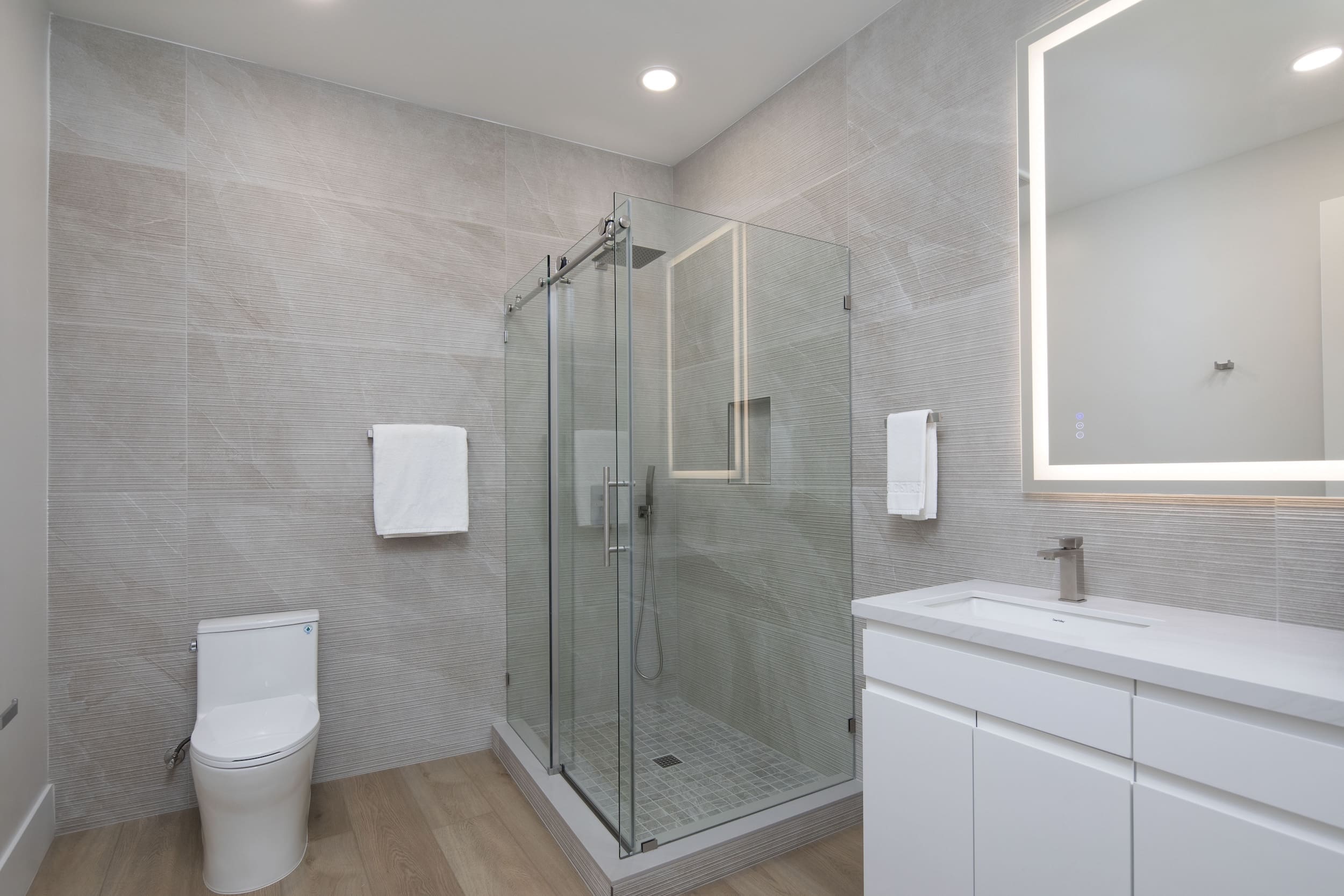 Modern ADU construction in San Diego with a stylish backyard.   Custom-built accessory dwelling unit (ADU) with energy-efficient design.   San Diego ADU builders working on a detached guest house.   Luxury home remodeling project in San Diego featuring a modern kitchen.   San Diego home renovation with upgraded interiors and open floor plan.   Bathroom remodel in San Diego with sleek tile and custom vanity.   New home construction project in San Diego with contemporary design.   Experienced San Diego construction team building a custom home.   High-quality residential construction site in San Diego.