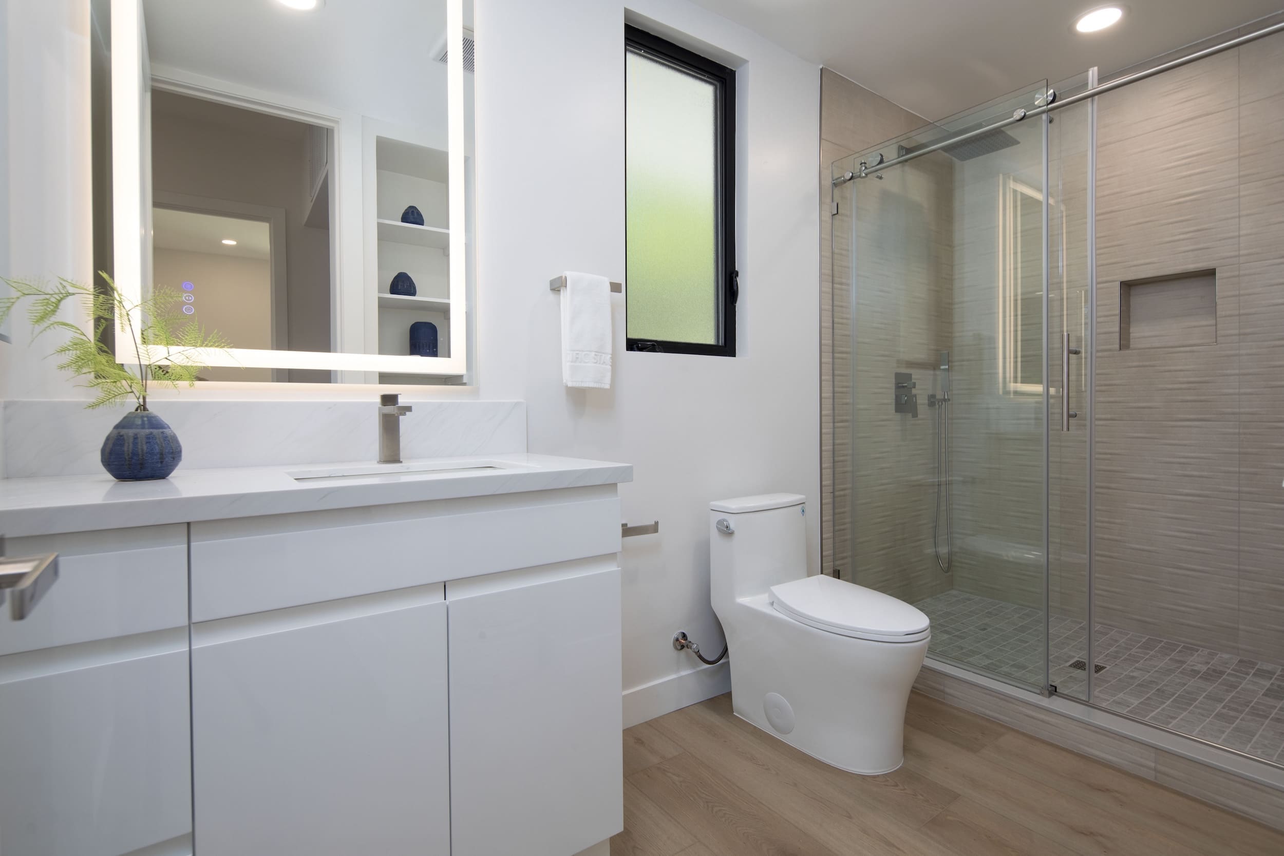 Modern ADU construction in San Diego with a stylish backyard.   Custom-built accessory dwelling unit (ADU) with energy-efficient design.   San Diego ADU builders working on a detached guest house.   Luxury home remodeling project in San Diego featuring a modern kitchen.   San Diego home renovation with upgraded interiors and open floor plan.   Bathroom remodel in San Diego with sleek tile and custom vanity.   New home construction project in San Diego with contemporary design.   Experienced San Diego construction team building a custom home.   High-quality residential construction site in San Diego.