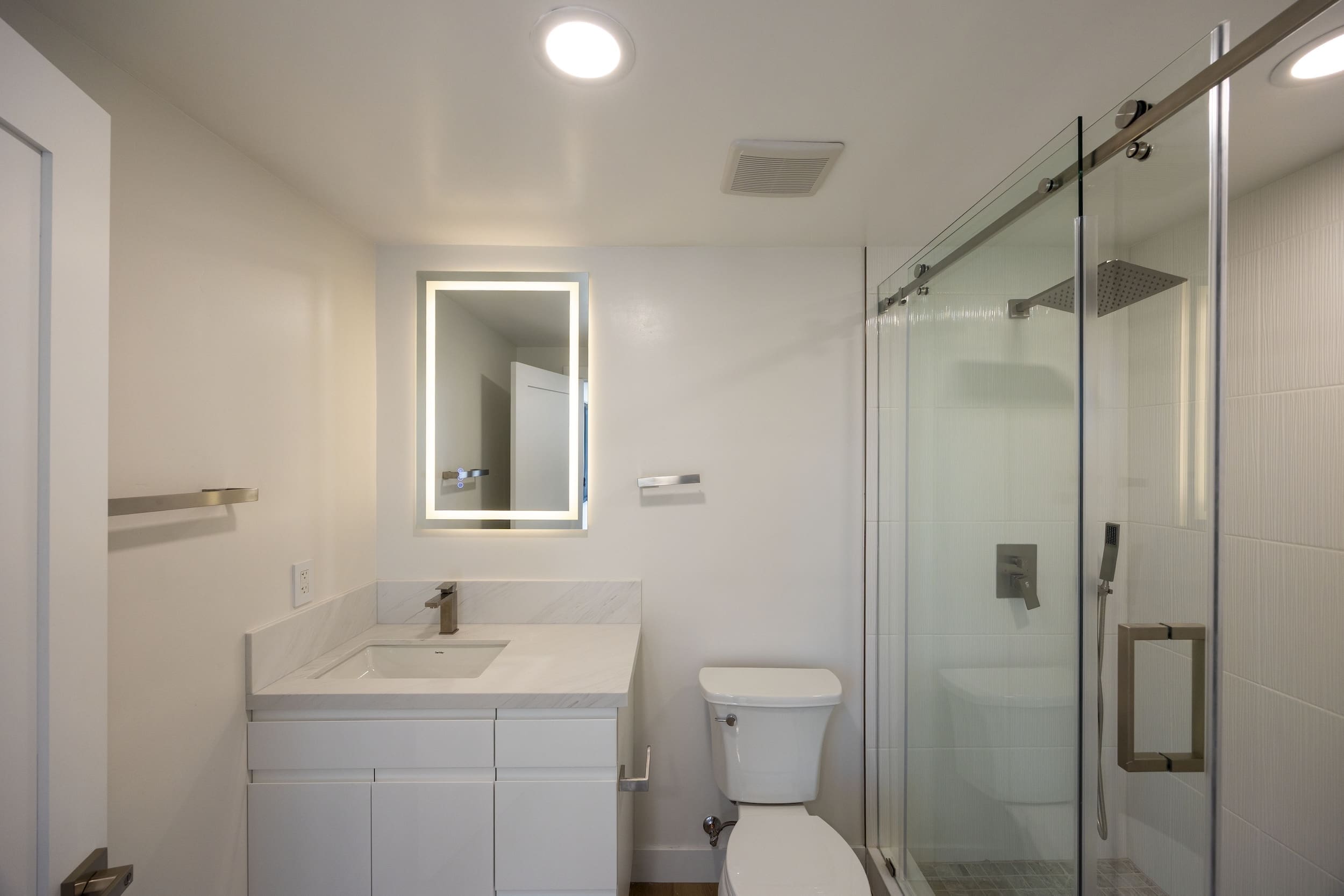 Modern ADU construction in San Diego with a stylish backyard.   Custom-built accessory dwelling unit (ADU) with energy-efficient design.   San Diego ADU builders working on a detached guest house.   Luxury home remodeling project in San Diego featuring a modern kitchen.   San Diego home renovation with upgraded interiors and open floor plan.   Bathroom remodel in San Diego with sleek tile and custom vanity.   New home construction project in San Diego with contemporary design.   Experienced San Diego construction team building a custom home.   High-quality residential construction site in San Diego.