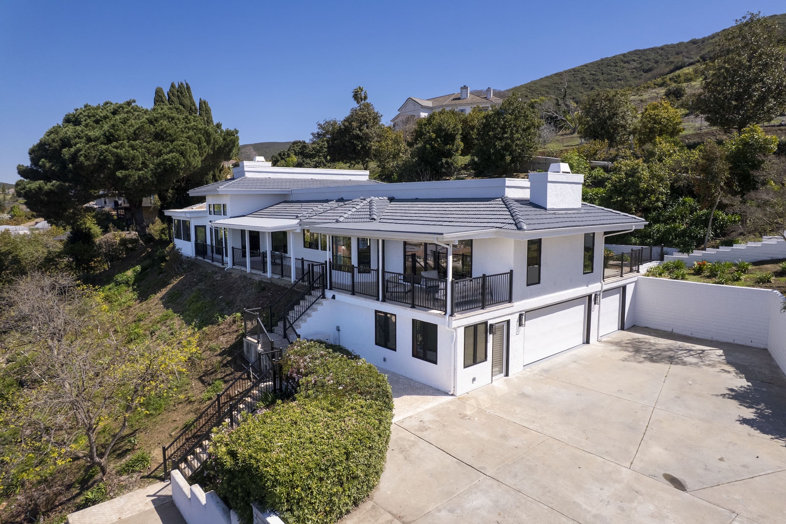 Modern ADU construction in San Diego with a stylish backyard.   Custom-built accessory dwelling unit (ADU) with energy-efficient design.   San Diego ADU builders working on a detached guest house.   Luxury home remodeling project in San Diego featuring a modern kitchen.   San Diego home renovation with upgraded interiors and open floor plan.   Bathroom remodel in San Diego with sleek tile and custom vanity.   New home construction project in San Diego with contemporary design.   Experienced San Diego construction team building a custom home.   High-quality residential construction site in San Diego.