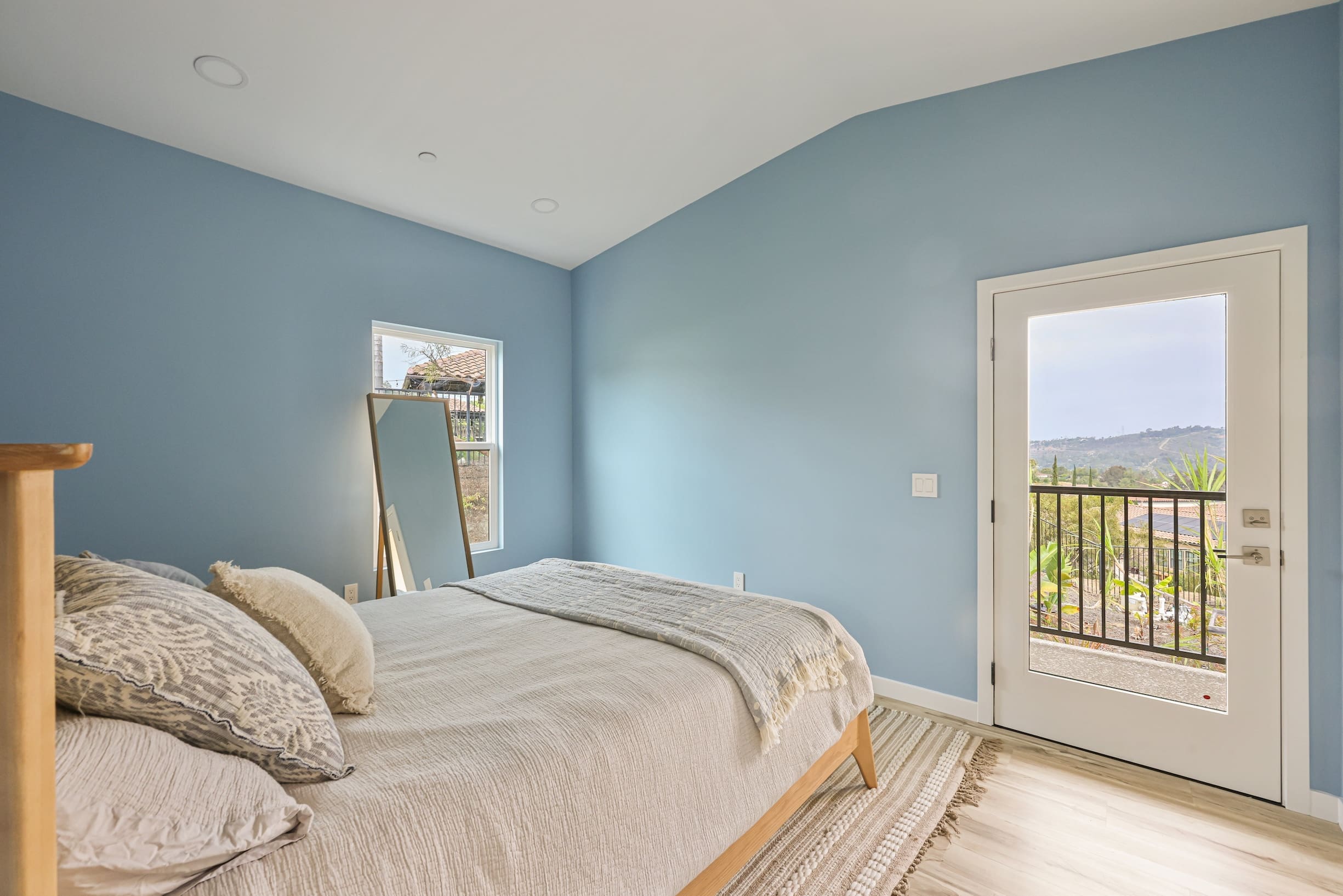Cozy bedroom with blue walls.
