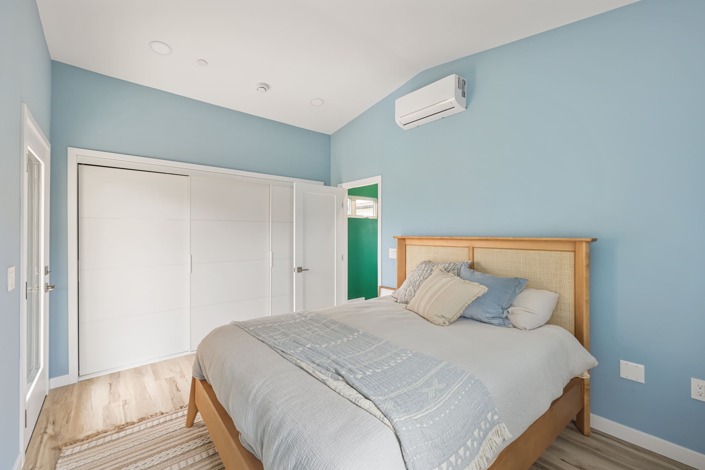 Cozy bedroom with blue walls.