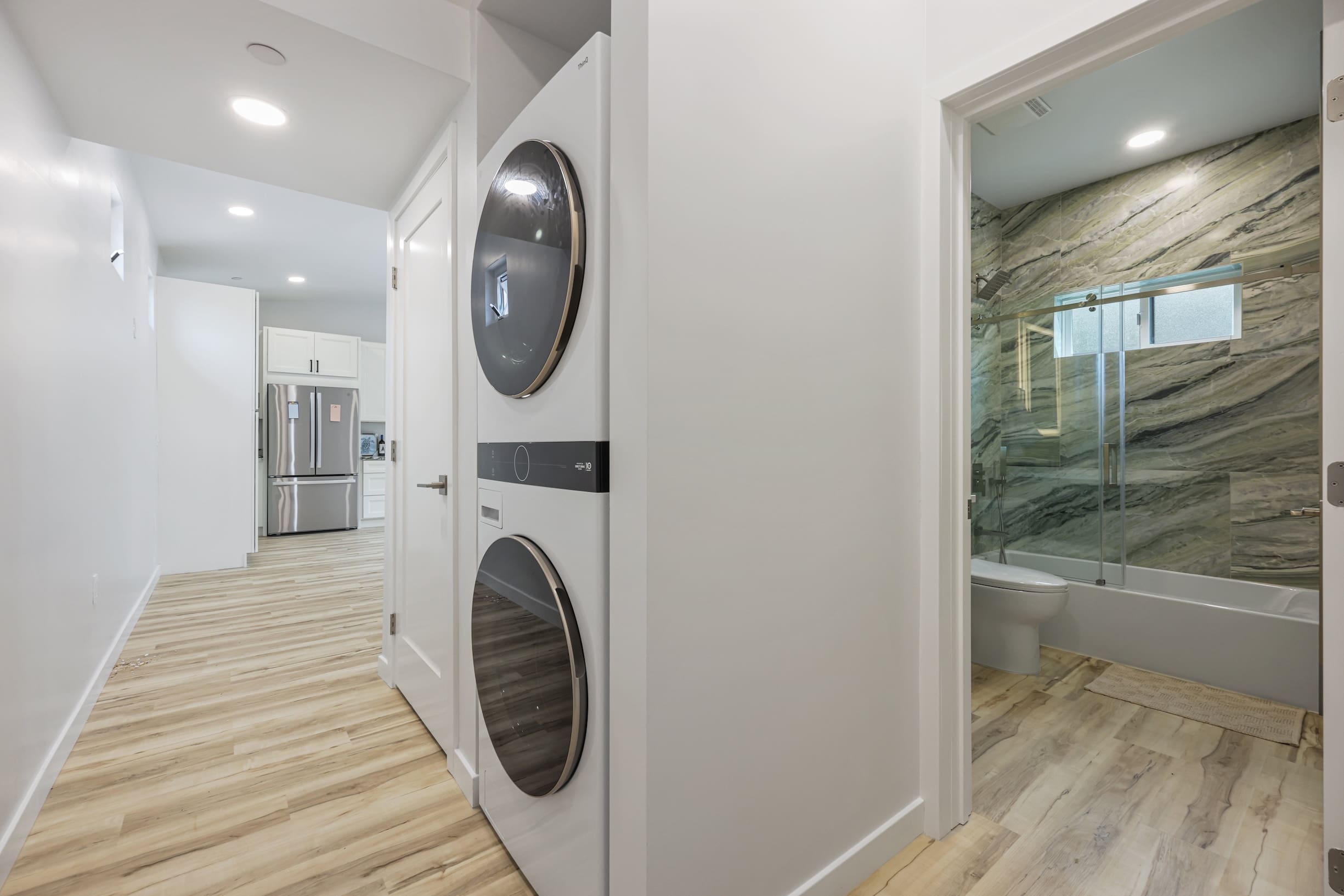 Modern hallway with laundry and bathroom