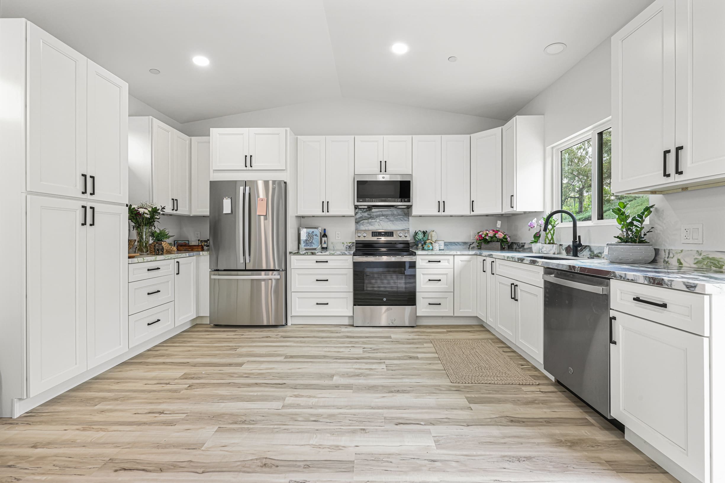 Modern kitchen with white cabinetry.